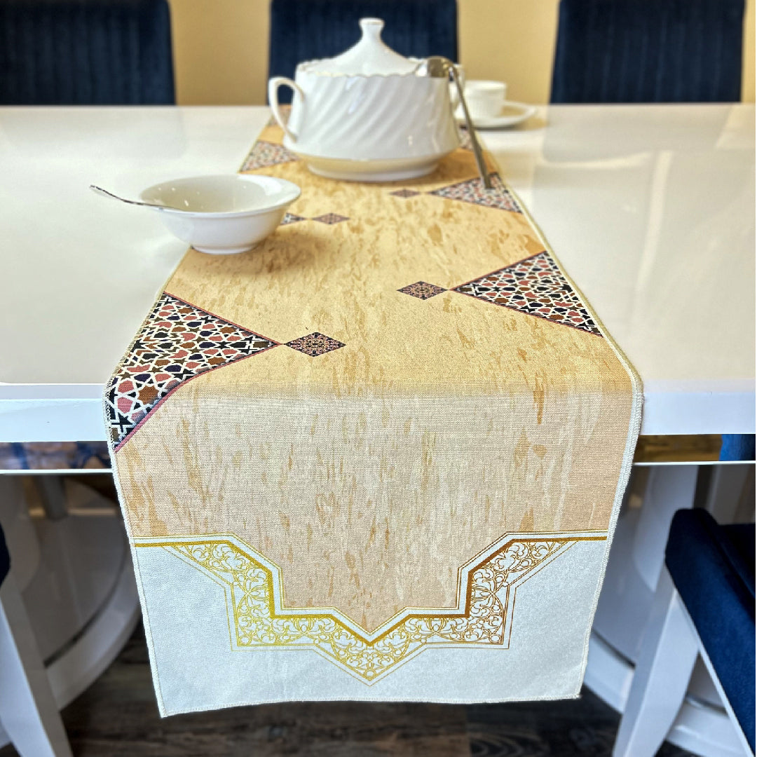 tableware on a beige table runner printed with brown Islamic art