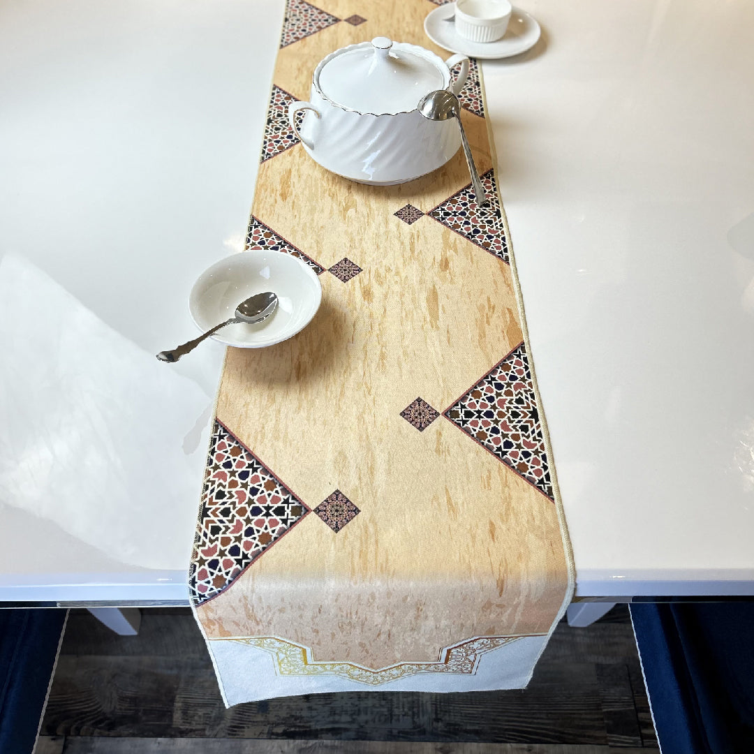 tableware on a beige table runner with brown Islamic print