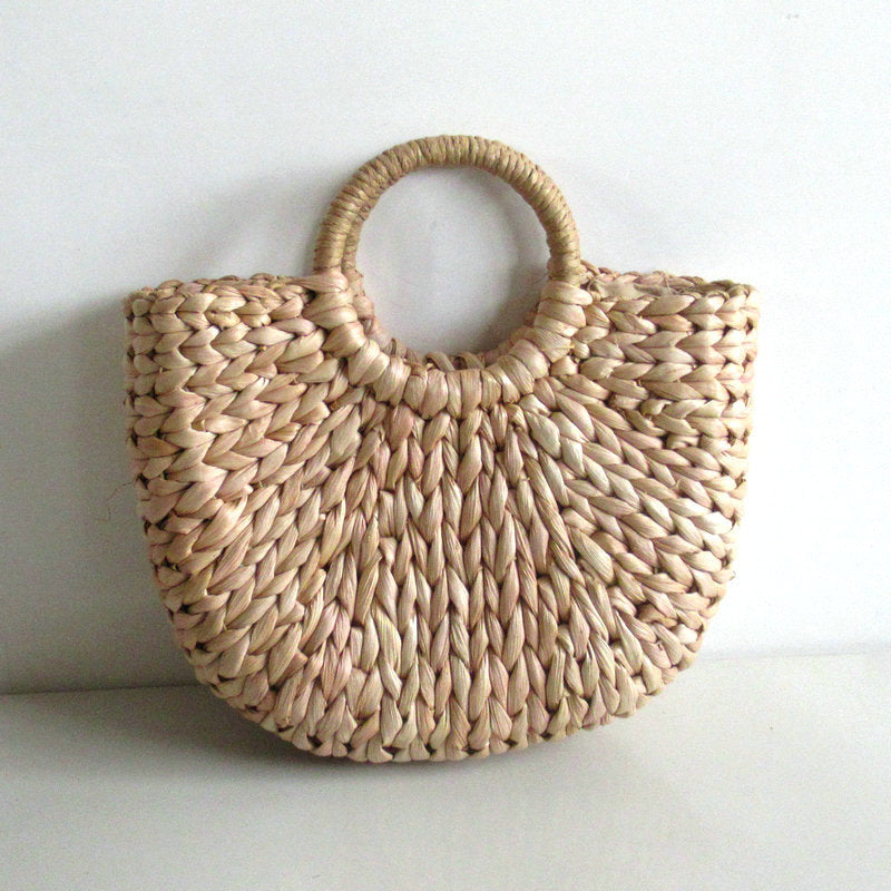 A women's handbag woven from bamboo