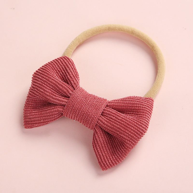 A hair tie decorated with his bow
