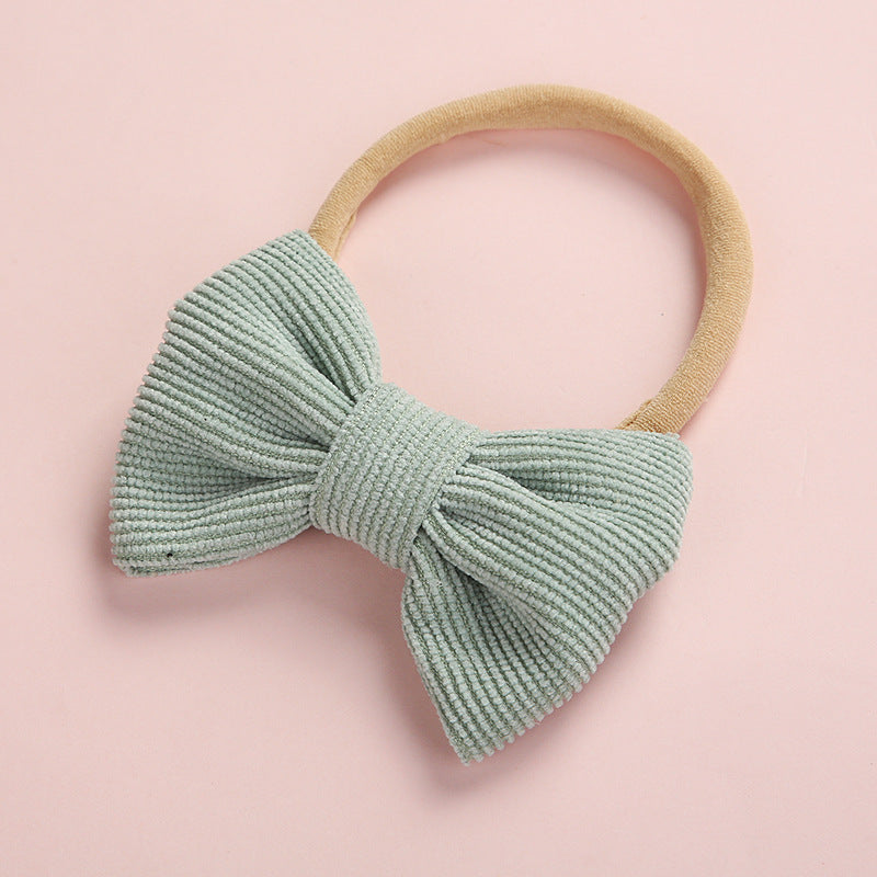 A hair tie decorated with his bow