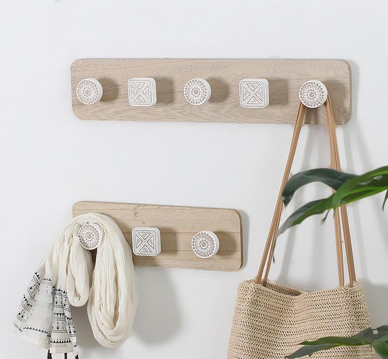 Wooden clothes hook hanging on the wall