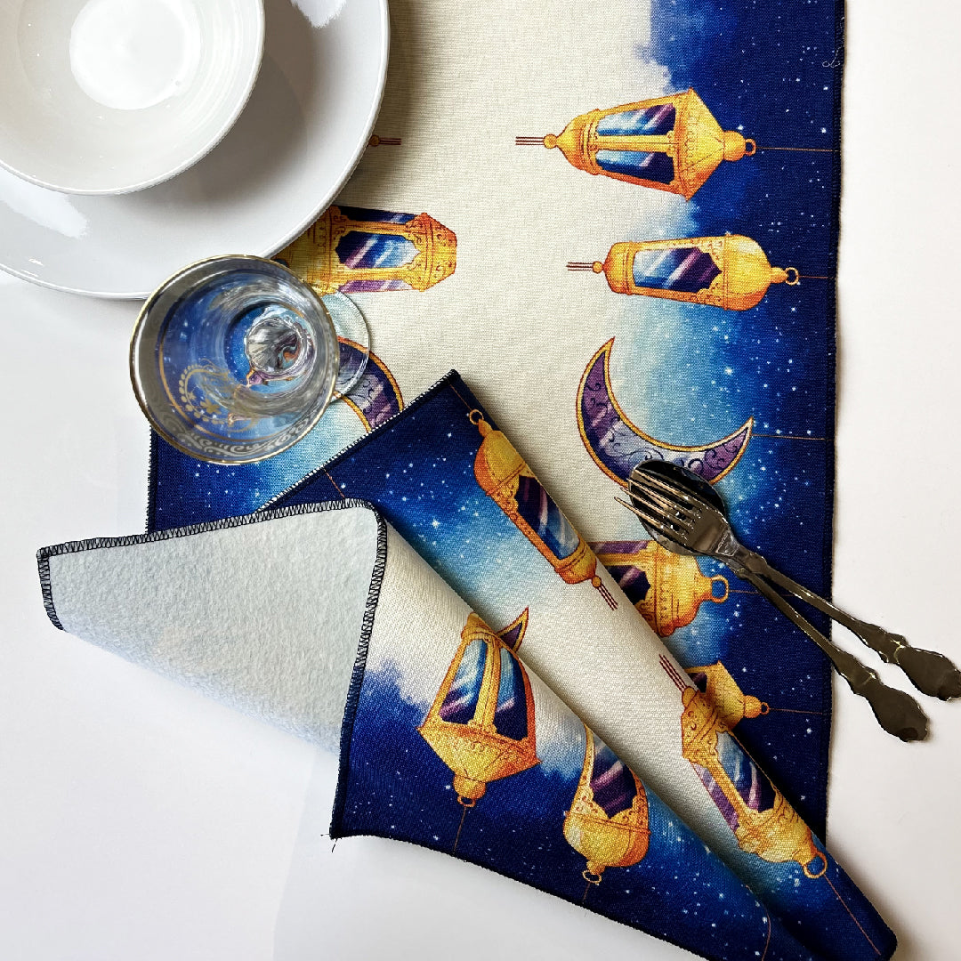 folded blue table runner with golden lanterns and crescent print