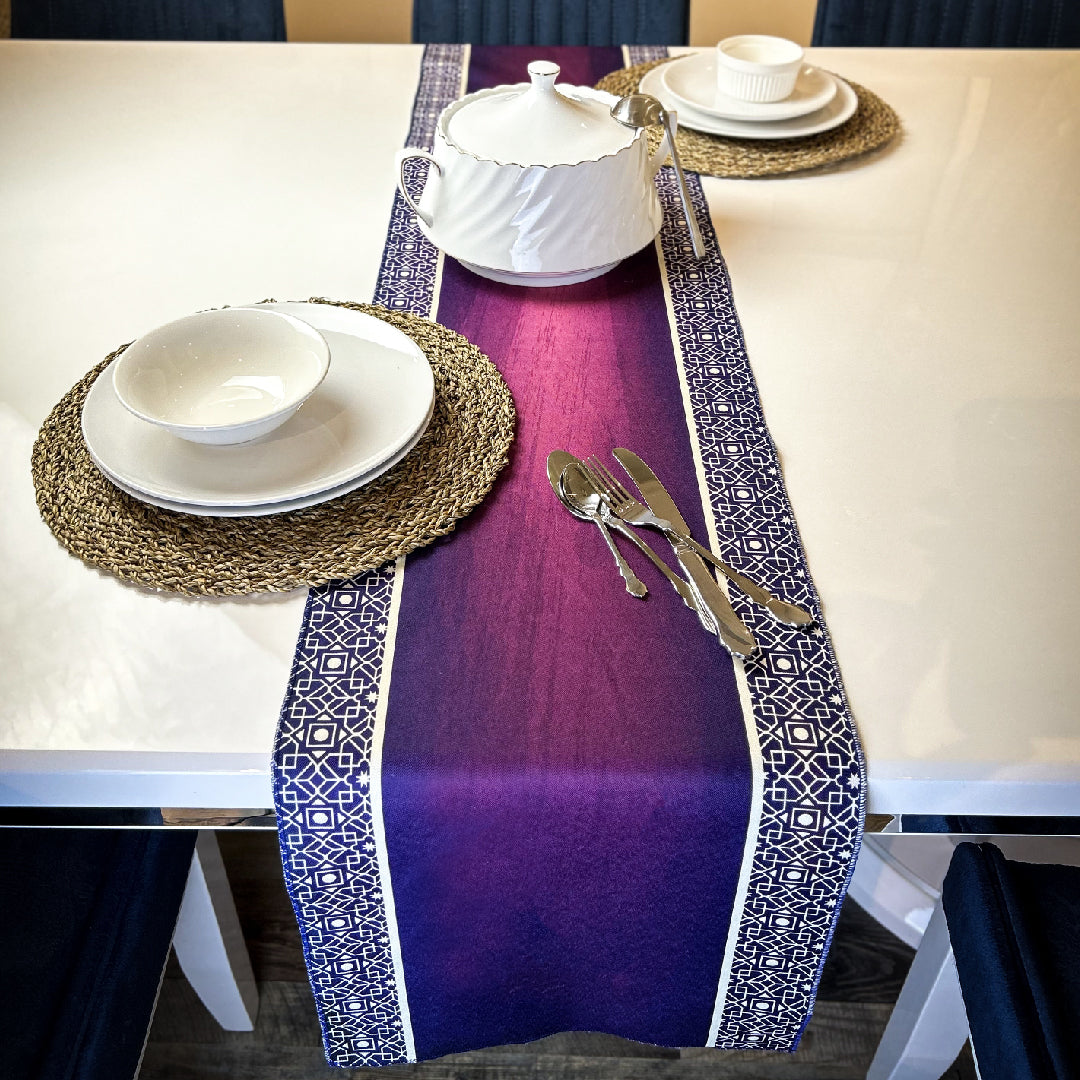 white tableware and cutlery set on a purple table runner