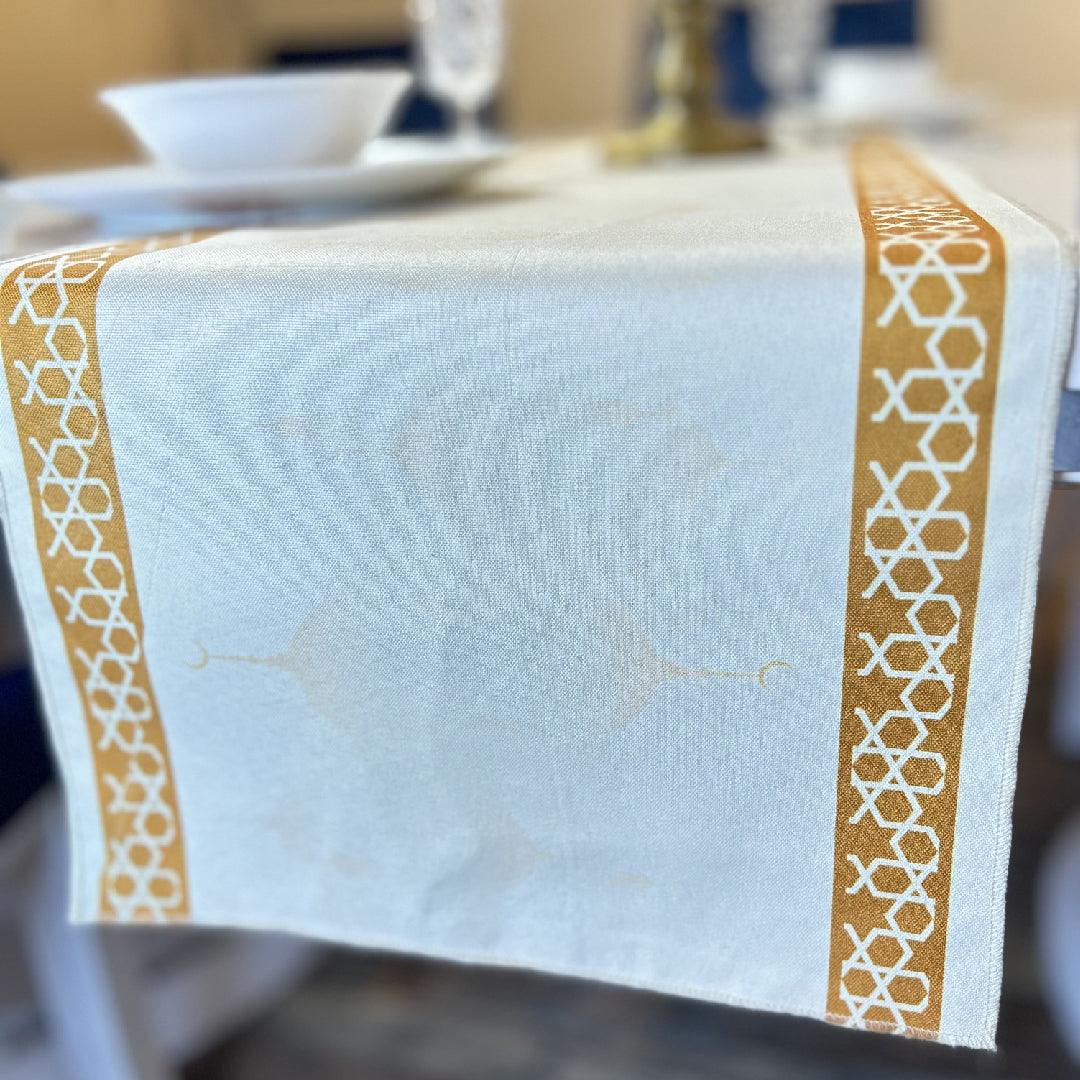 beige table runner with golden abstract print