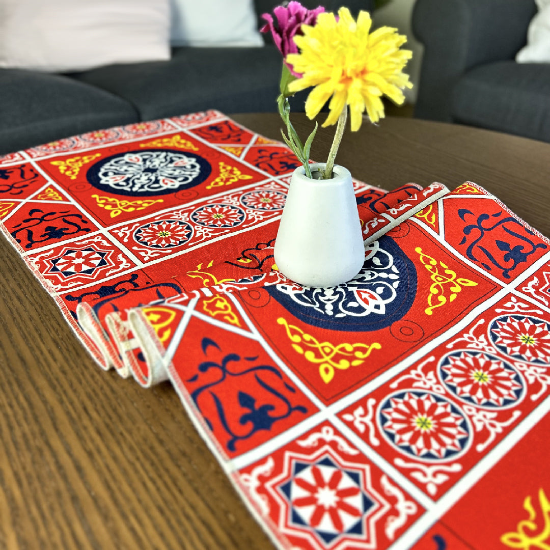 orange table runner with a vase